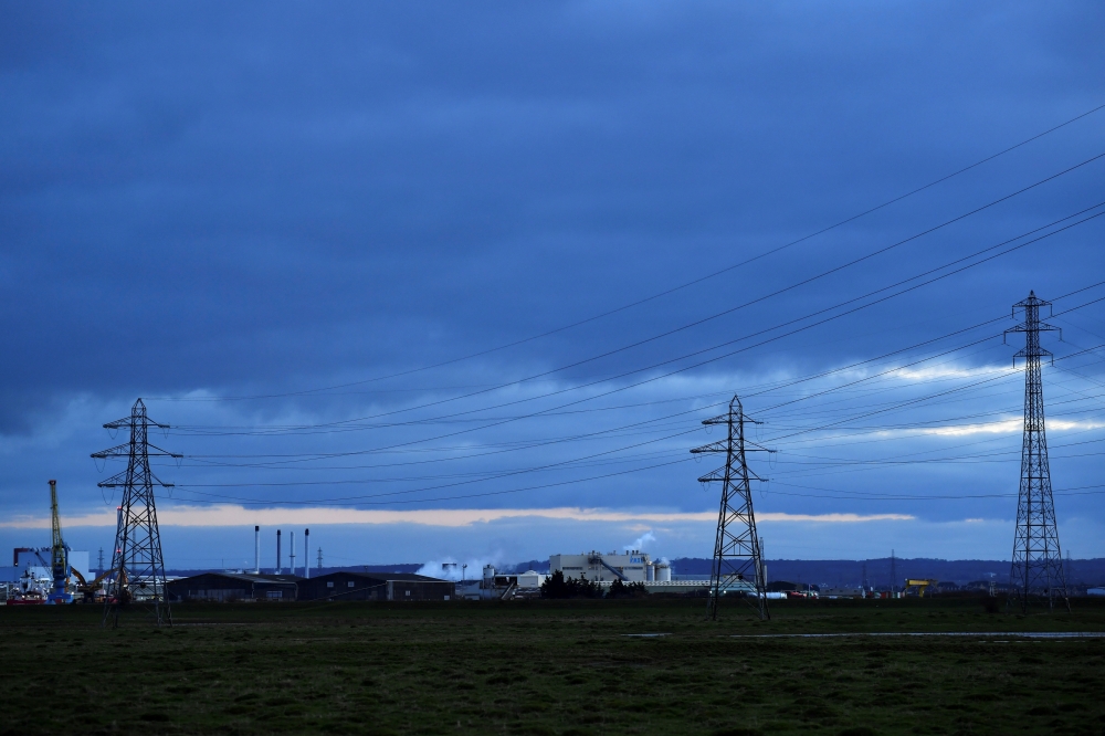 A factory and electricity pylons are seen from Sheerness, on the Isle of Sheppey, Britain, March 5, 2021. RUTERS/Dylan Martinez/File Photo