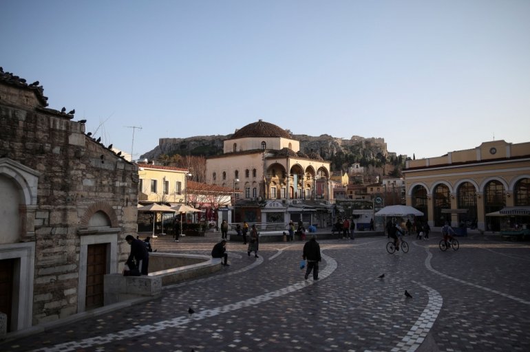 People make their way on Monastiraki square, amid the coronavirus disease (COVID-19) pandemic, in Athens, Greece, March 10, 2021. Picture taken March 10, 2021. REUTERS/Louiza Vradi
