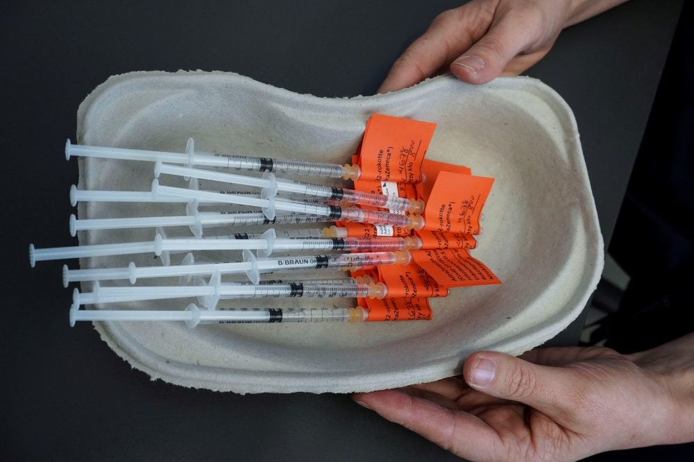 Syringes with AstraZeneca vaccine against the coronavirus disease (COVID-19) are pictured in Laakso hospital in Helsinki, Finland March 11, 2021. Picture taken March 11, 2021. REUTERS/Essi Lehto/File Photo