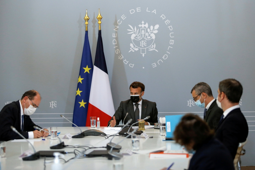 French President Emmanuel Macron attends a weekly meeting with Prime Minister Jean Castex, Secretary-General of the Elysee Palace Alexis Kohler, Government's spokesman Gabriel Attal, and Health Minister Olivier Veran, about the coronavirus disease (COVID-