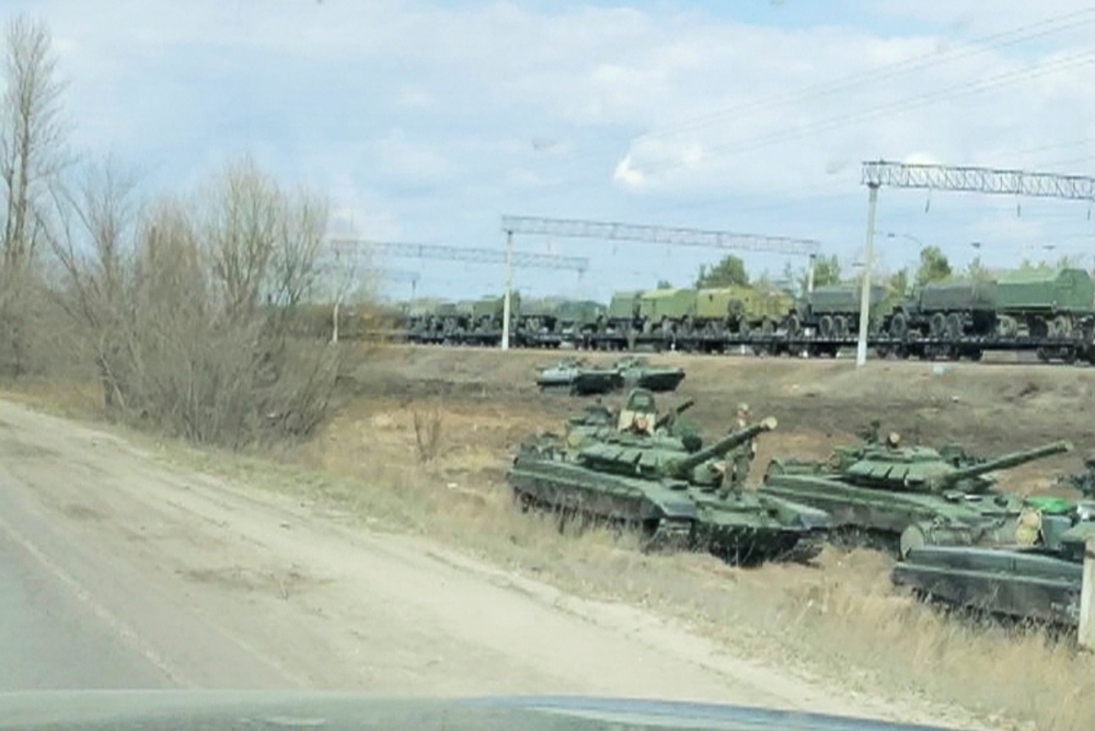 FILE PHOTO: A still image from video shows tanks and military vehicles in Maslovka, Voronezh Region, Russia April 6, 2021. 
