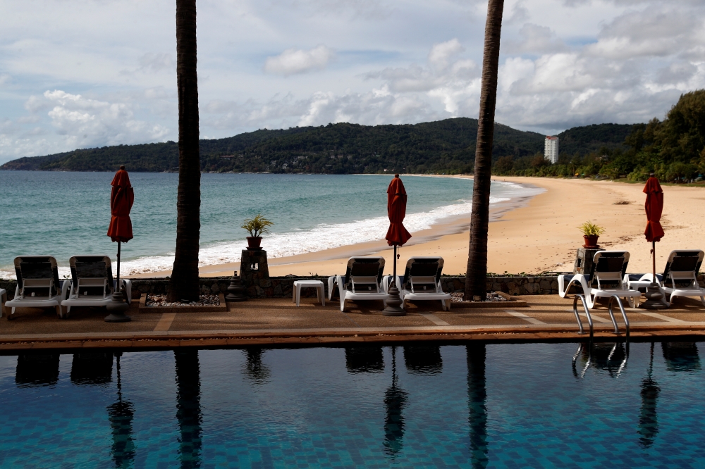 An empty hotel and beach which have opened for visitors is seen in Karon, Phuket Island, Thailand March 31, 2021. Picture taken March 31, 2021. REUTERS/Jorge Silva