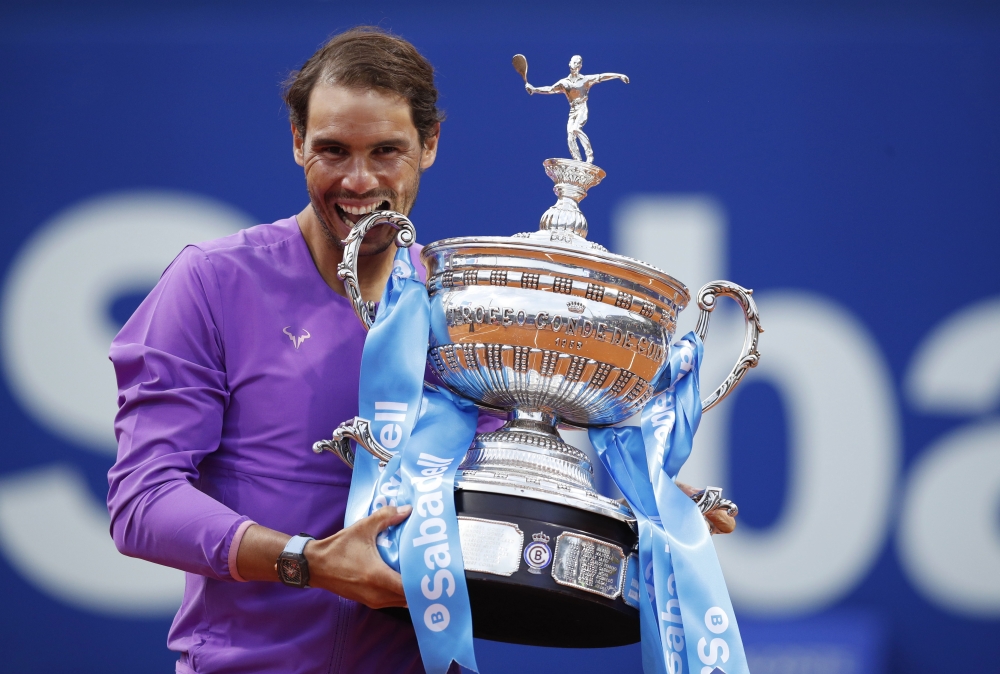 April 25, 2021 Spain's Rafael Nadal celebrates with the trophy after winning the Barcelona Open against Greece's Stefanos Tsitsipas REUTERS/Albert Gea