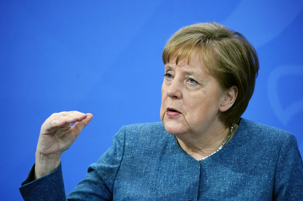 German Chancellor Angela Merkel attends a news conference after discussing the country's vaccination campaign with the leaders of Germany's 16 federal states, amid the outbreak of the coronavirus disease (COVID-19), in Berlin, Germany, April 26, 2021. Mic