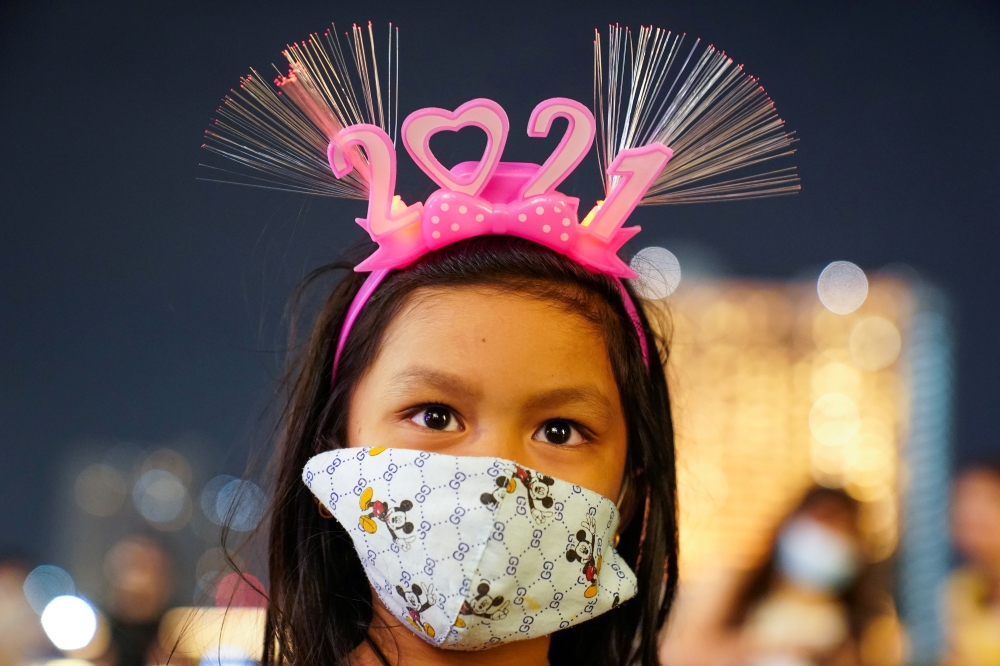 A girl wearing a mask and 