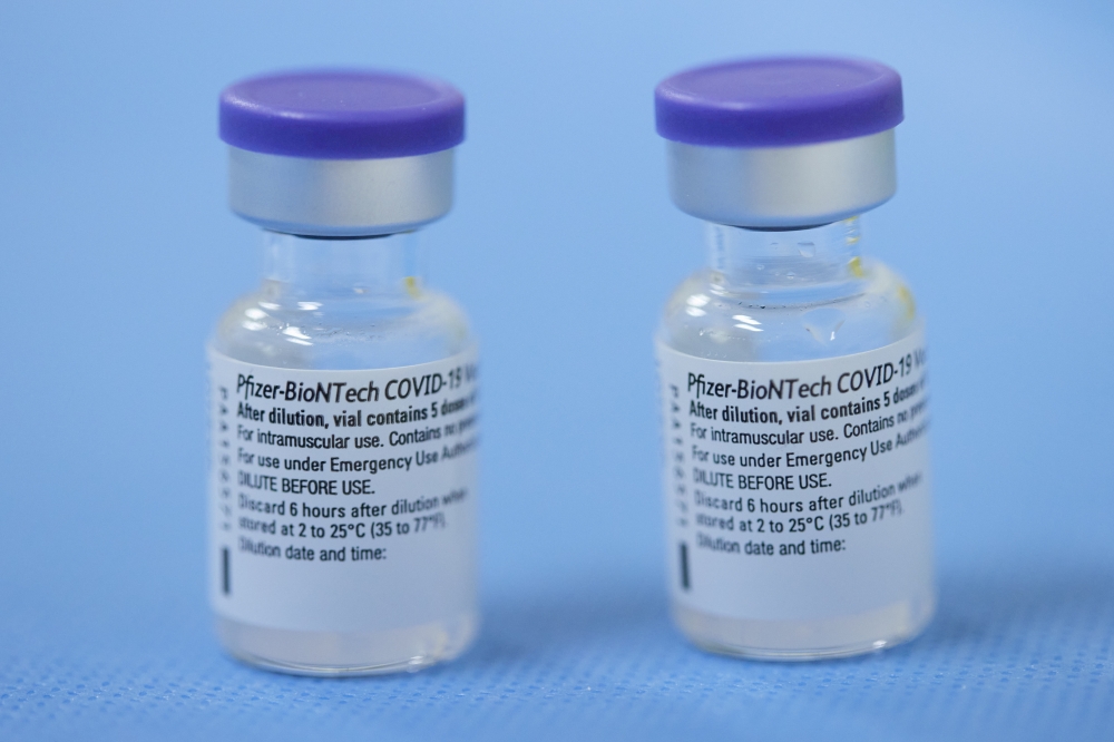 Vials of the Pfizer-BioNTech vaccine are pictured in a vaccination centre in Geneva, Switzerland, February 3, 2021. REUTERS/Denis Balibouse/File Photo