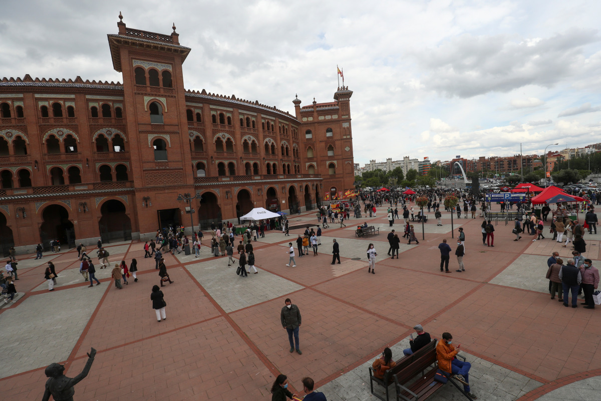 People stand outside Las Ventas bullring ahead of the first bullfight since the start of the coronavirus disease (COVID-19) pandemic, in Madrid, Spain, May 2, 2021. REUTERS/Susana Vera

