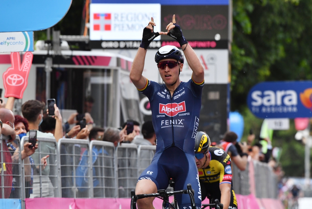 May 9, 2021 Alpecin-Fenix rider Tim Merlier of Belgium celebrates as he crosses the finish line to win the stage REUTERS/Jennifer Lorenzini
