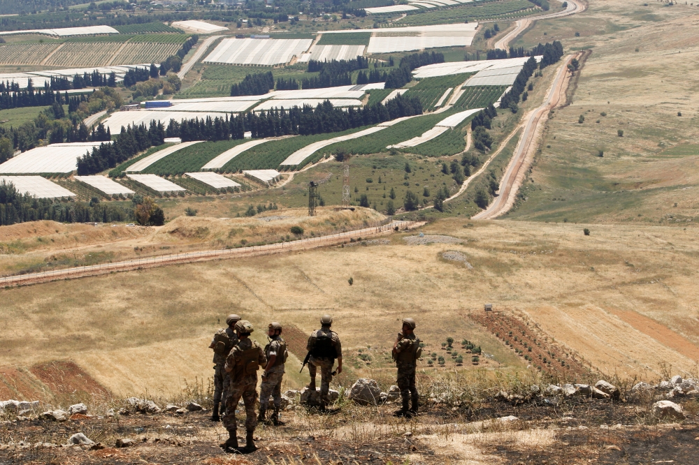 Lebanese soldiers stand in Maroun Al-Ras village, near the border with Israel, in southern Lebanon, May 16, 2021. REUTERS/Aziz Taher