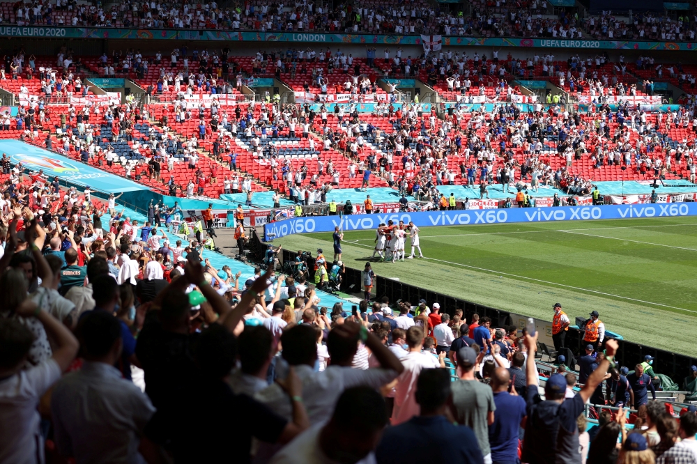 General view as England's Raheem Sterling celebrates scoring their first goal with team mates and fans Pool via REUTERS/Catherine Ivill/File Photo