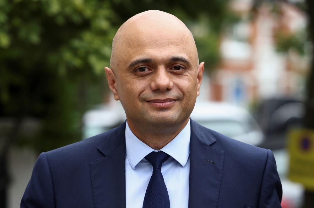 Britain's new Health Secretary Sajid Javid walks outside his home in London, Britain June 27, 2021. REUTERS/Henry Nicholls