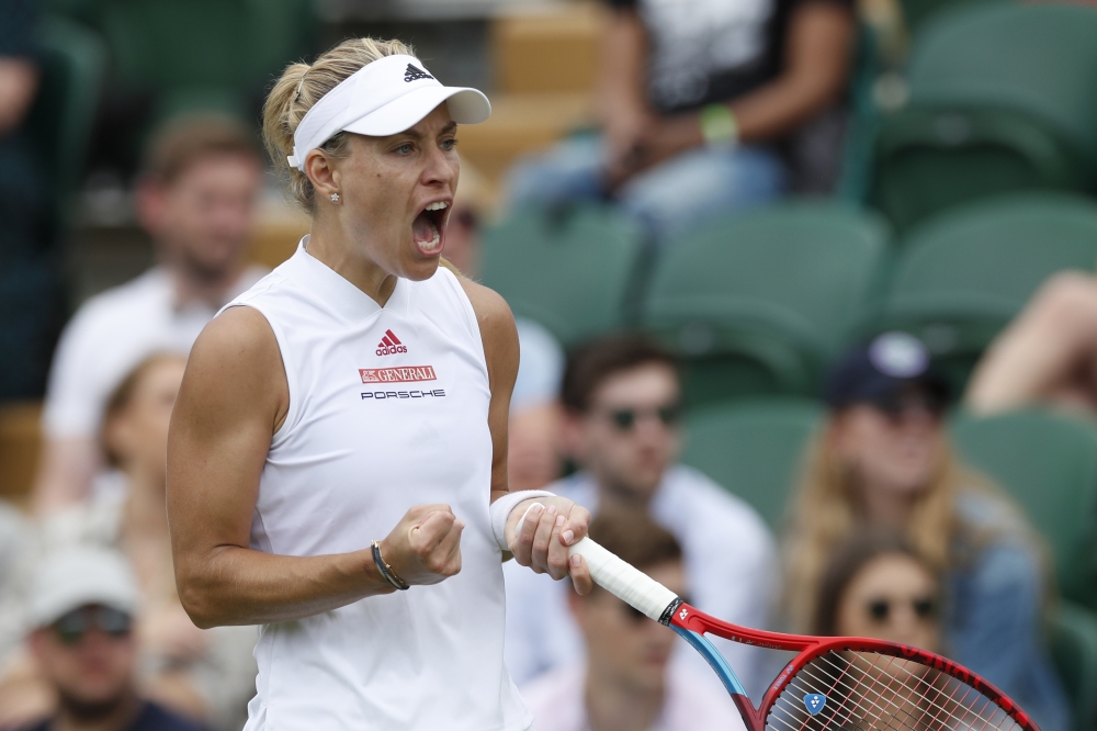 Germany's Angelique Kerber celebrates winning her third round match against Belarus' Aliaksandra Sasnovich. (Reuters/Paul Childs)