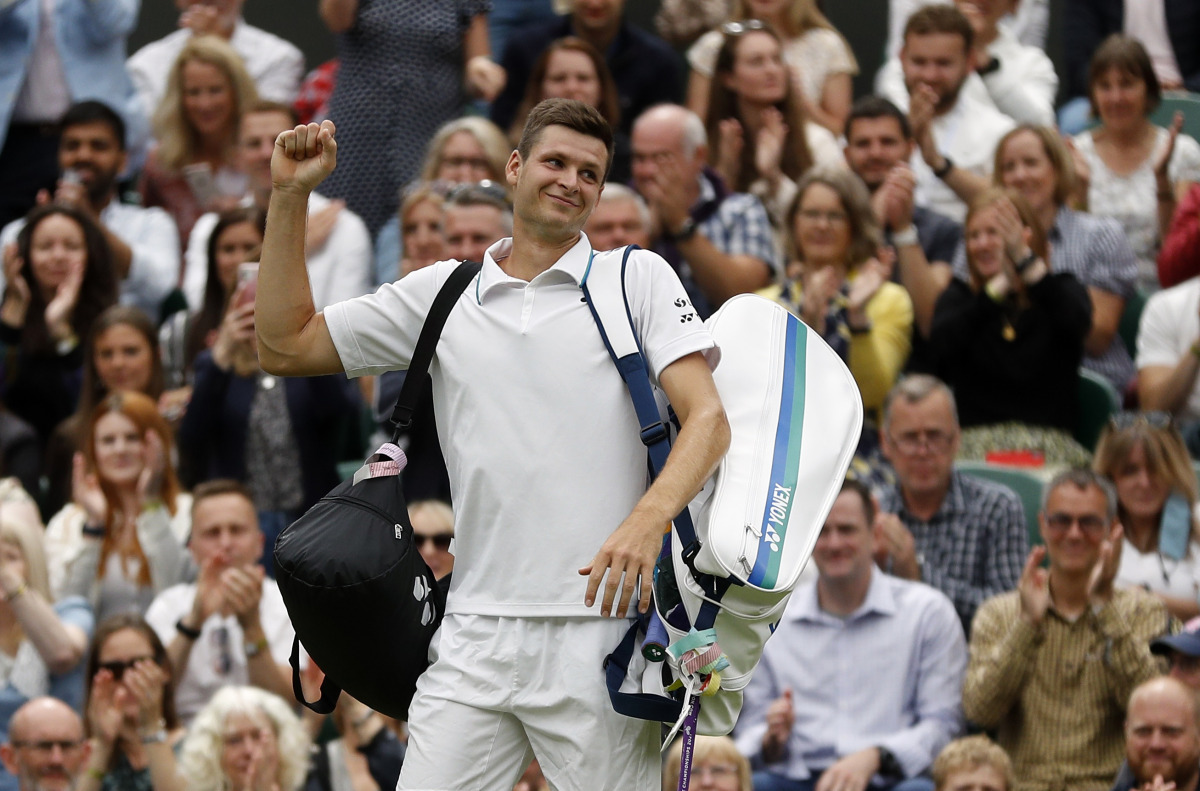 Tennis - Wimbledon - All England Lawn Tennis and Croquet Club, London, Britain - July 6, 2021 Poland's Hubert Hurkacz acknowledges the spectators as he walks off the court after winning his fourth round match against Russia's Daniil Medvedev REUTERS/Peter