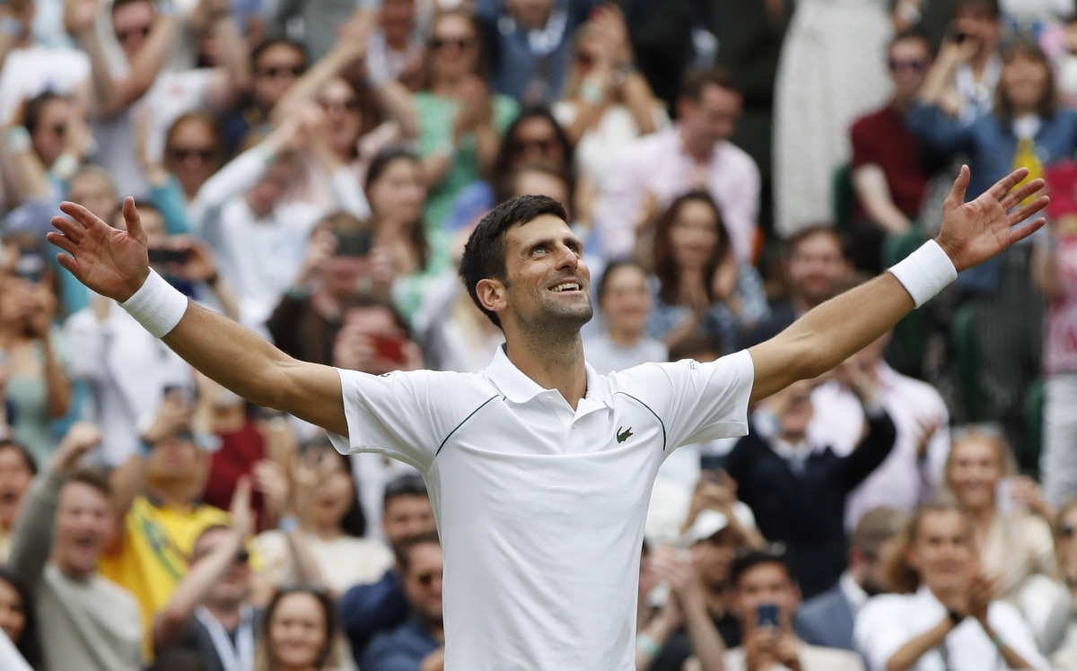 Tennis - Wimbledon - All England Lawn Tennis and Croquet Club, London, Britain - July 11, 2021 Serbia's Novak Djokovic celebrates winning his final match against Italy's Matteo Berrettini REUTERS/Paul Childs
