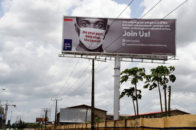 A billboard mounted at the Airport Road to campaign against the spread of the COVID-19 coronavirus is seen in Ikeja in Lagos, on April 20, 2020. / AFP / PIUS UTOMI EKPEI
