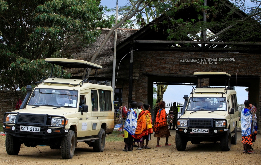 Kenyan women sell souvenirs to visitors as they arrive at the Maasai Mara game reserve amid the coronavirus disease (COVID-19) pandemic in Narok county, Kenya, July 16, 2021. REUTERS/Monicah Mwangi