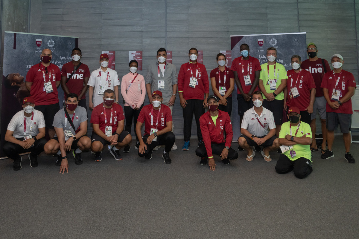 President of Qatar Olympic Committee (QOC), H E Sheikh Joaan bin Hamad Al Thani, posing for a photograph with Team Qatar athletes and officials during a visit to the Athletes Village of the Tokyo 2020 Olympics, yesterday. QOC Secretary-General Jassim bin 