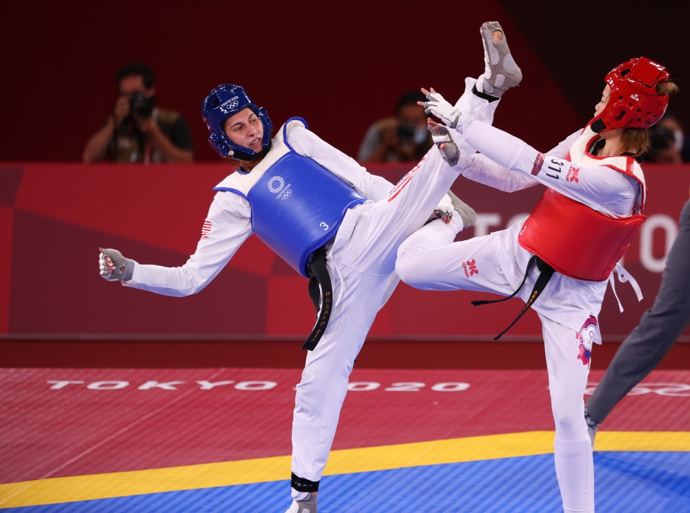Tokyo 2020 Olympics - Women's Featherweight 49-57kg - Semifinal - Makuhari Messe Hall A, Chiba, Japan - July 25, 2021. Anastasija Zolotic of the United States in action against Lo Chia-Ling of Taiwan REUTERS/Murad Sezer
