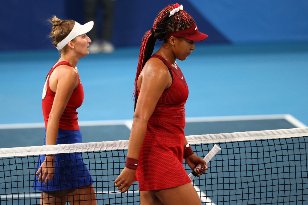 Naomi Osaka of Japan with Marketa Vondrousova of Czech Republic after their third round match REUTERS/Mike Segar