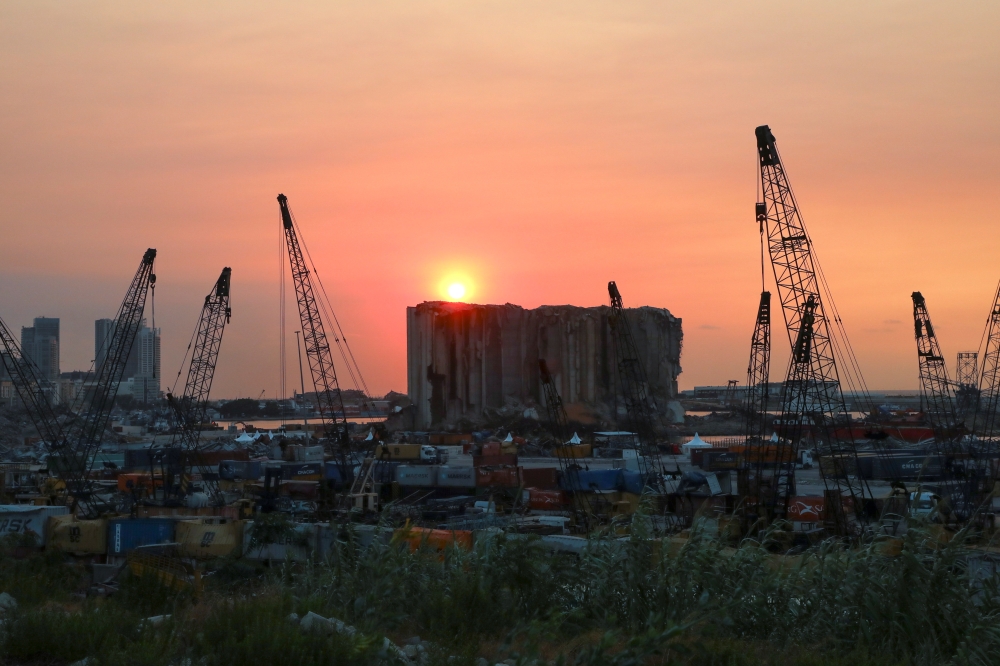 A view shows the grain silo that was damaged during last year's Beirut port blast, during sunset in Beirut, Lebanon, July 29, 2021. Picture taken July 29, 2021. REUTERS/Mohamed Azakir