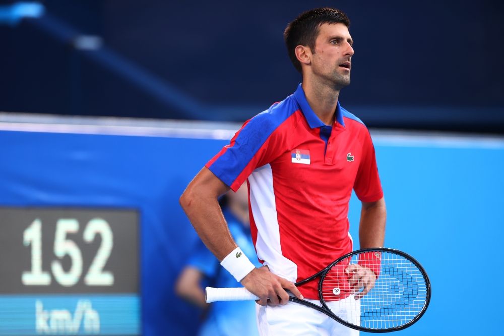 Novak Djokovic of Serbia reacts during his bronze medal match against Pablo Carreno of Spain (REUTERS/Edgar Su)