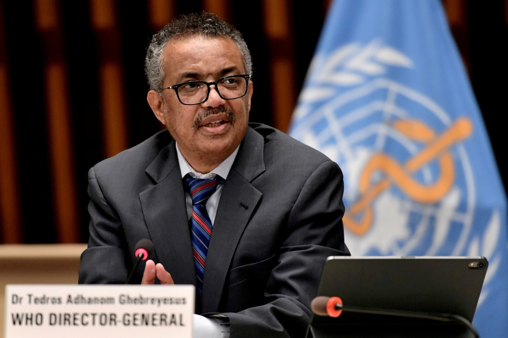 FILE PHOTO: World Health Organization chief Tedros Adhanom Ghebreyesus attends a ceremony to launch a multiyear partnership with Qatar on making FIFA Football World Cup 2022 and mega sporting events healthy and safe at the WHO headquarters, in Geneva, Swi