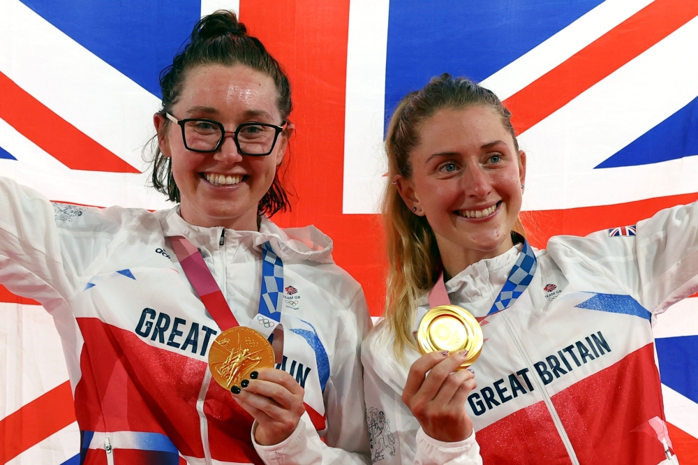 Gold medallists Laura Kenny of Britain and Katie Archibald of Britain celebrate on the podium. REUTERS/Matthew Childs