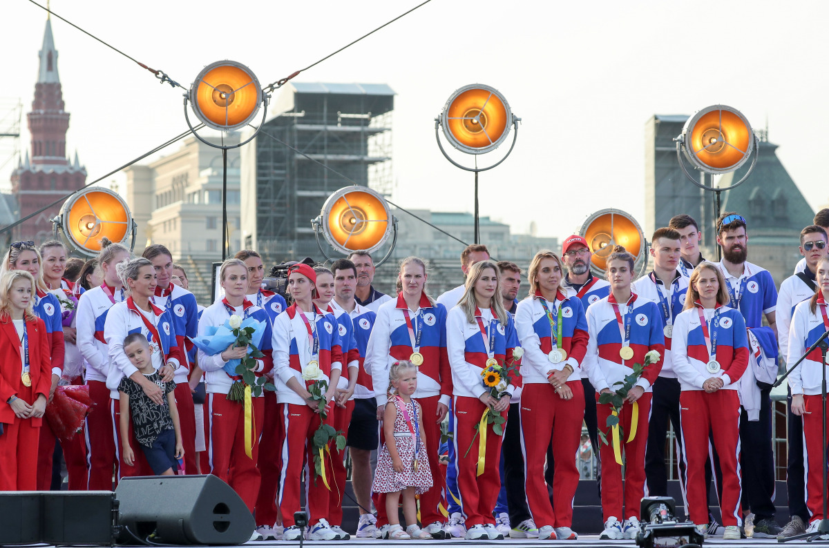 Athletes of the Russian Olympic Committee attend a welcoming ceremony after returning from the Tokyo 2020 Olympic Games on Red Square in Moscow, Russia August 9, 2021. REUTERS/Evgenia Novozhenina
