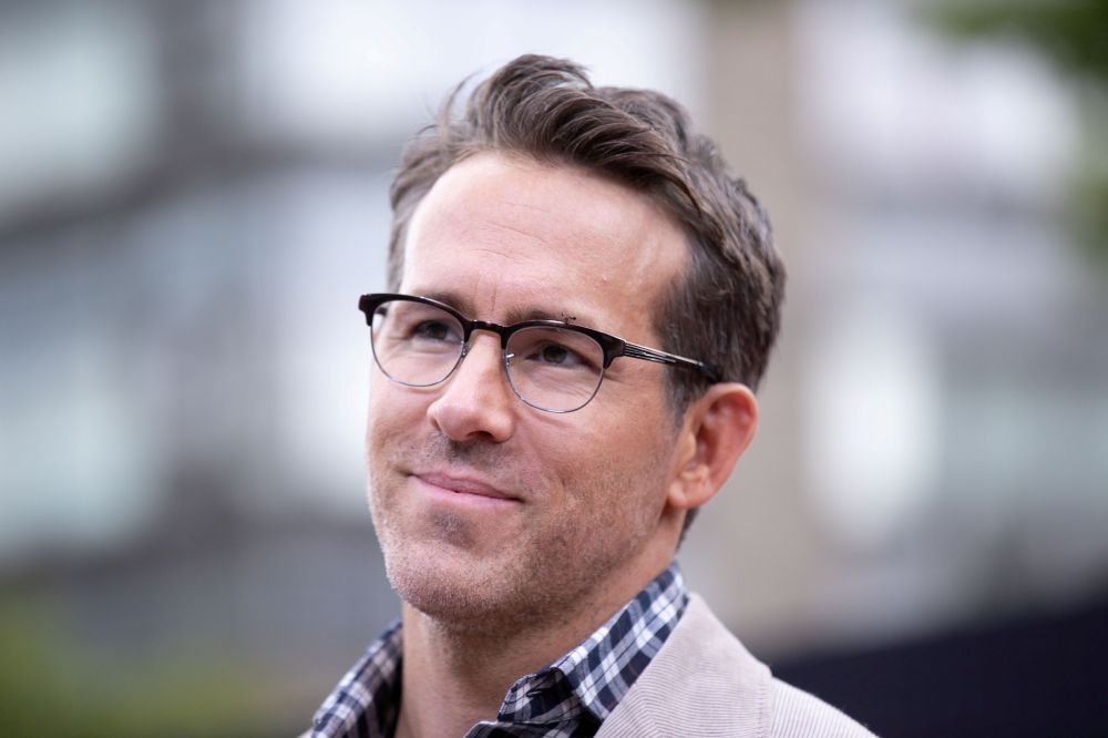 Actor Ryan Reynolds looks on as he arrives at the premiere for the film 