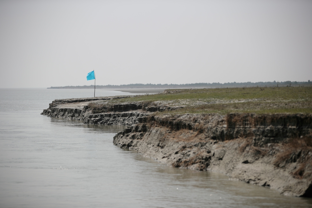FILE PHOTO: View of the island of Bhasan Char in the Bay of Bengal, Bangladesh February 14, 2018. Picture taken February 14, 2018. REUTERS