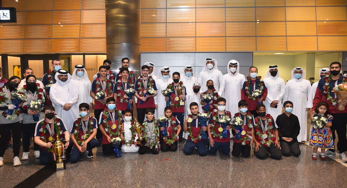 Officials of the Qatar Table Tennis Association pose for a photograph with the Team Qatar paddlers and officials upon their return to Doha at the Hamad International Airport yesterday. Pic: Abdul Basit