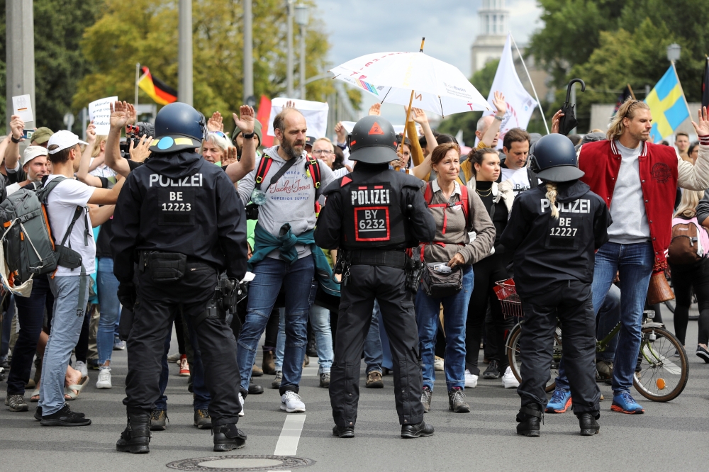 Demonstrators attend a protest against government measures to curb the spread of the coronavirus disease (COVID-19) in Berlin, Germany August 29, 2021. REUTERS/Christian Mang
