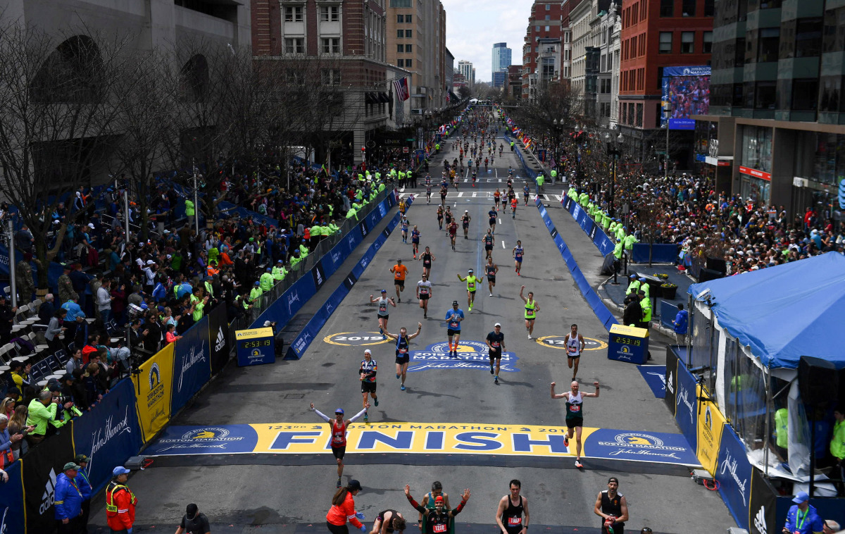 FILE PHOTO: Runners approach the finish line on Boylston Street during the 123rd Boston Marathon in Boston, Massachusetts, U.S., April 15, 2019. REUTERS/Gretchen Ertl/File Photo
