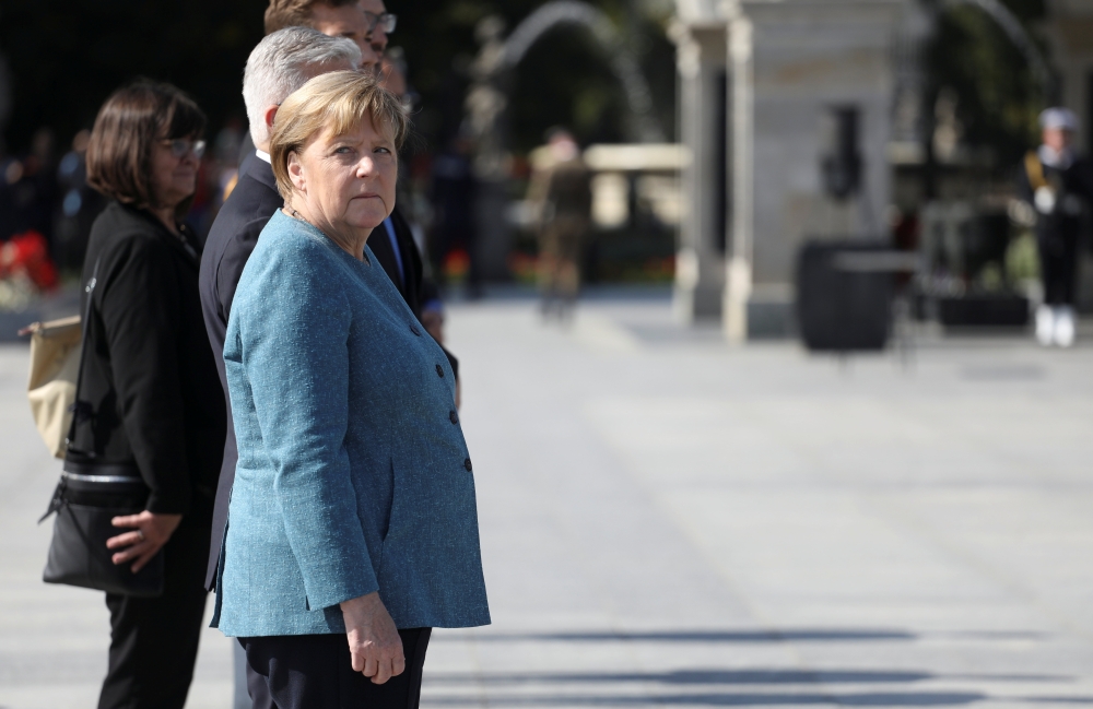 German Chancellor Angela Merkel attends the laying of flowers to the Tomb of the Unknown Soldier in Warsaw, Poland September 11, 2021. Maciek Jazwiecki/Agencja Gazeta