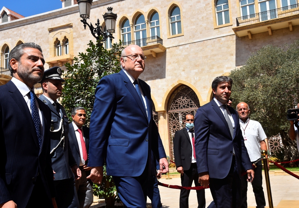 Lebanon's new Prime Minister Najib Mikati walks during an official ceremony to mark his assumption of duties at the Government Palace in Beirut, Lebanon September 13, 2021. Dalati Nohra