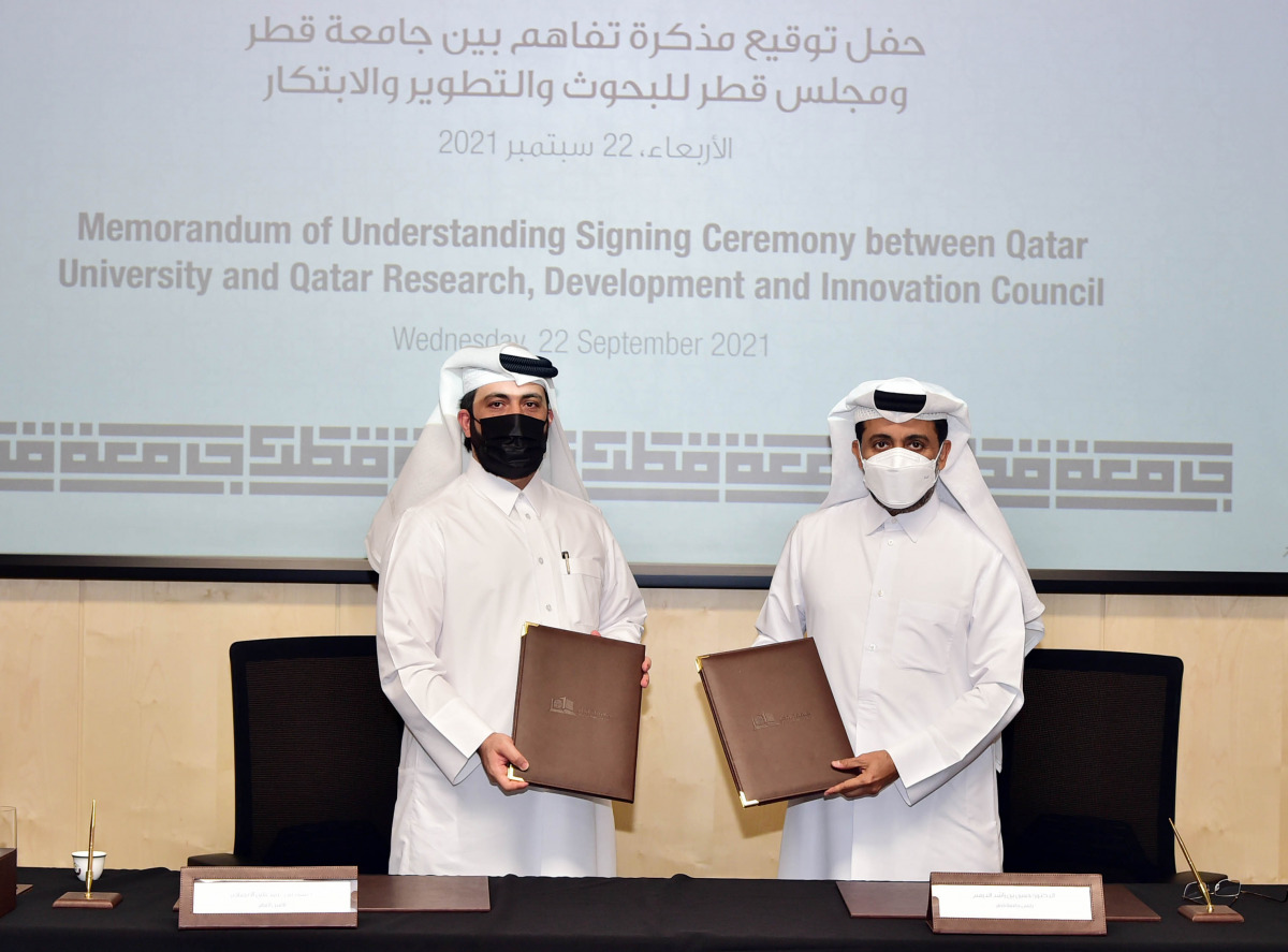 QU President Dr. Hassan Rashid Al Derham (right) and Secretary-General of QRDI Council Eng. Omar Ali Al Ansari at the MoU signing event held at Qatar University yesterday. 