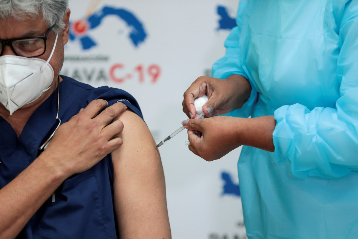 FILE PHOTO: A Panamanian health worker receives the second shot of the Pfizer-BioNTech COVID-19 vaccine at the Santo Tomas Hospital, in Panama City, Panama February 17, 2021. REUTERS/Erick Marciscano/File Photo
