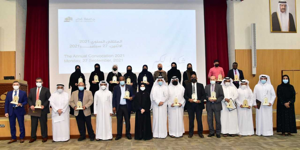 Qatar University President Dr. Hassan Rashid Al Derham with university's faculty, staff and students who won annual excellence awards.  
