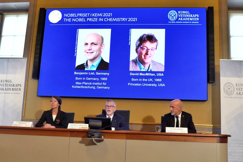 Secretary General of the Royal Swedish Academy of Sciences Goran K. Hansson, Member of the Nobel Committee for Chemistry Pernilla Wittung-Stafhede and Member of the Nobel Committee for Chemistry Peter Somfai, attend the announcement of the 2021 Nobel Priz