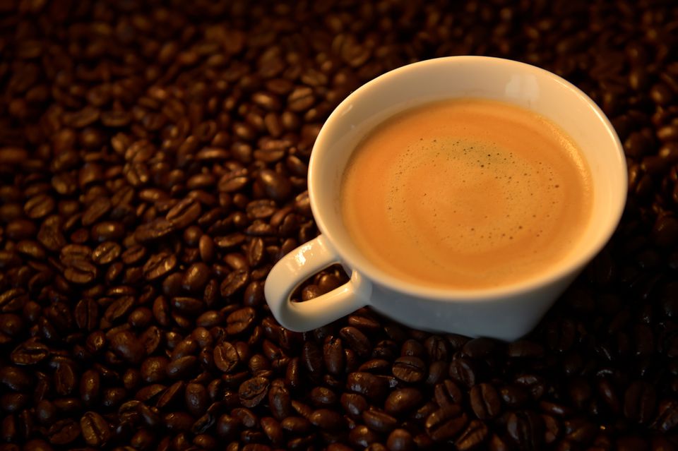 An illustration picture shows a coffee cup and roasted coffee beans in Brussels, Belgium May 1, 2017. REUTERS/Eric Vidal/Illustration