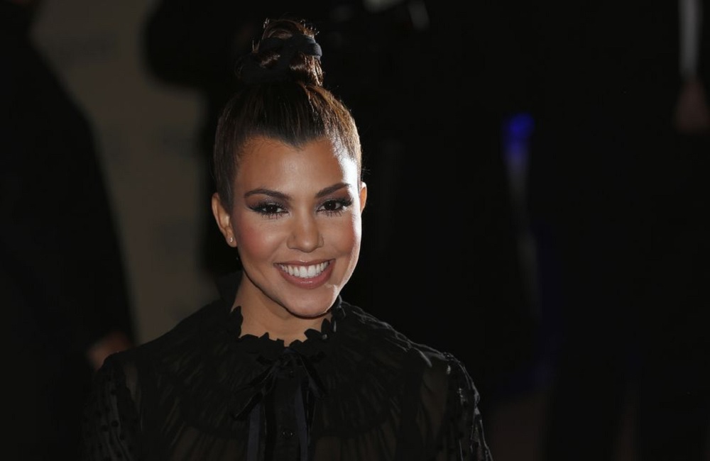 Kourtney Kardashian arrives for the launch of her clothing line Kardashian Kollection for the British high street retail chain Dorothy Perkins in London. Reuters/Suzanne Plunkett
