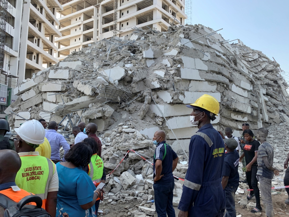 Emergency personnel stands by the debris of the collapsed building in Ikoyi, Lagos, Nigeria, November 1, 2021. Picture taken November 1, 2021. REUTERS/Nneka Chile