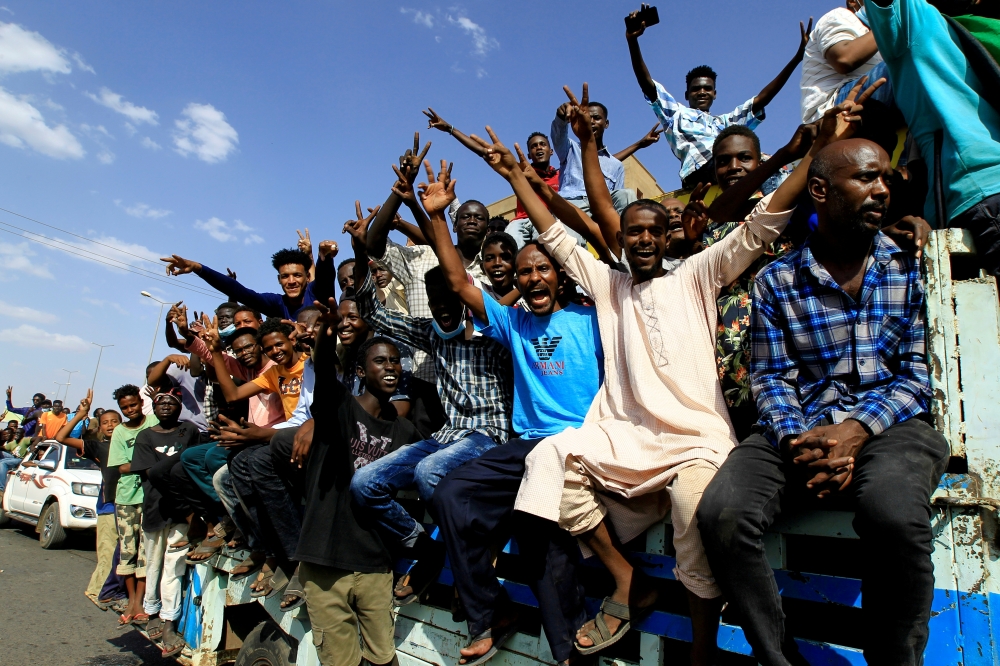 FILE PHOTO: Protesters gesture and shout slogans as they demonstrate against the Sudanese military's recent seizure of power and ousting of the civilian government, in the capital Khartoum, Sudan October 30, 2021. REUTERS/Mohamed Nureldin