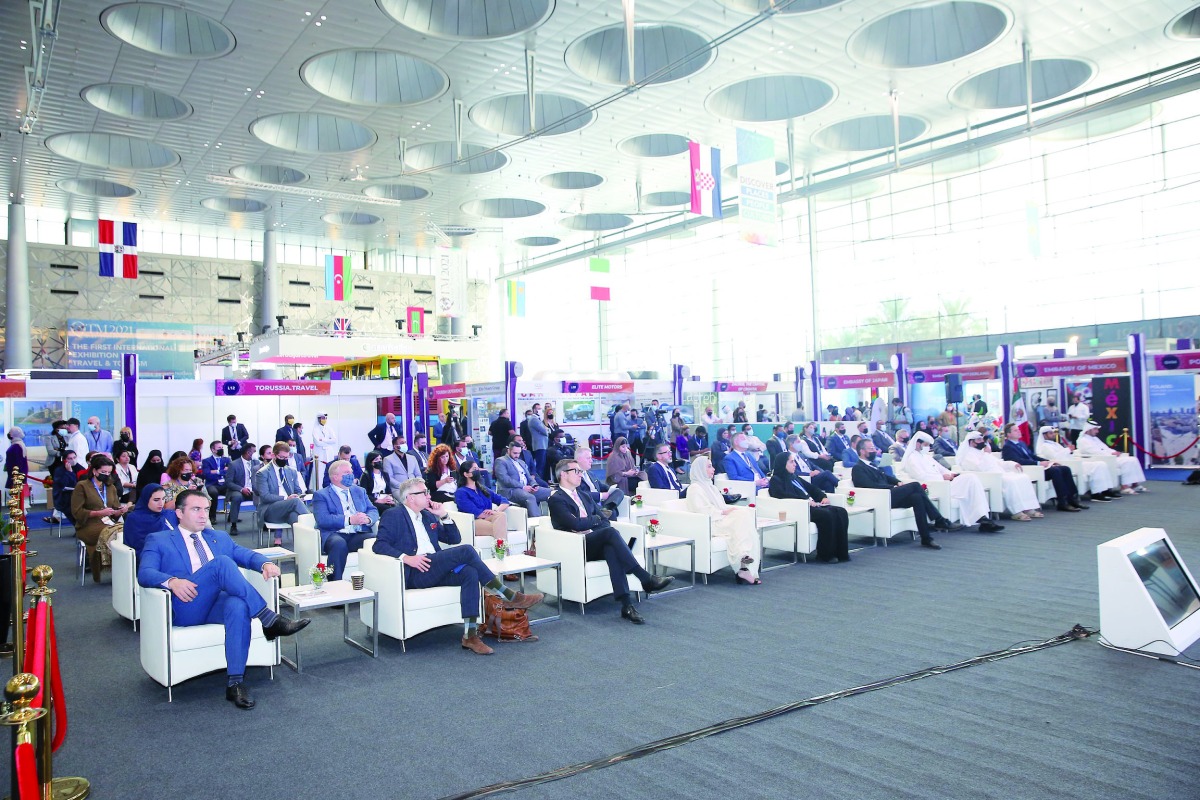 Officials and guests in a session during Qatar Travel Mart 2021.