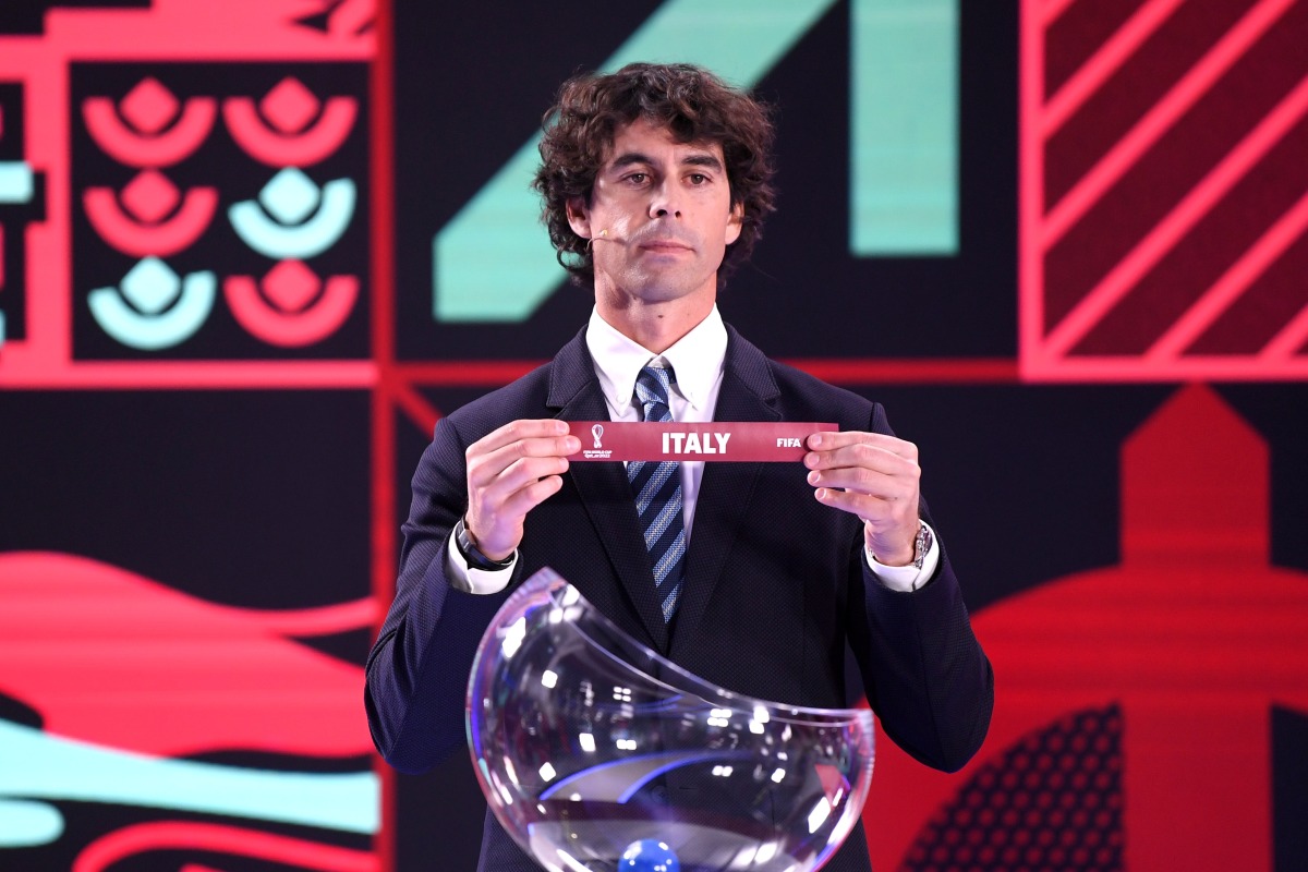 Portuguese former football player Tiago picks Italy during the draw for the European and Intercontinental play-offs for the FIFA World Cup Qatar 2022, in Zurich.