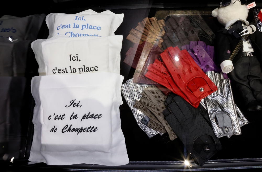 Three small embroidered cushions for the cat Choupette and leather gloves are displayed before the auction of late fashion designer Karl Lagerfeld?s Collection by Sotheby's auction house in Monte-Carlo, Monaco, November 30, 2021. REUTERS/Eric Gaillard