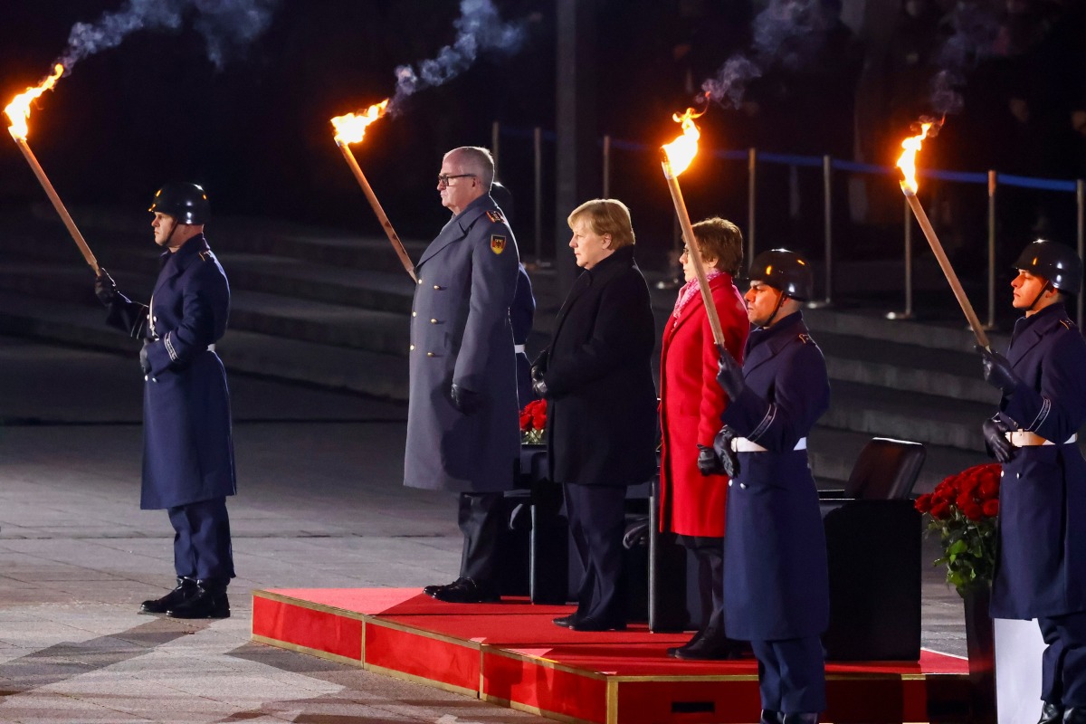 Germany's outgoing Chancellor Angela Merkel attends a Grand Tattoo of the German armed forces Bundeswehr at the Defence Ministry in Berlin, Germany, December 2, 2021. REUTERS/Fabrizio Bensch
