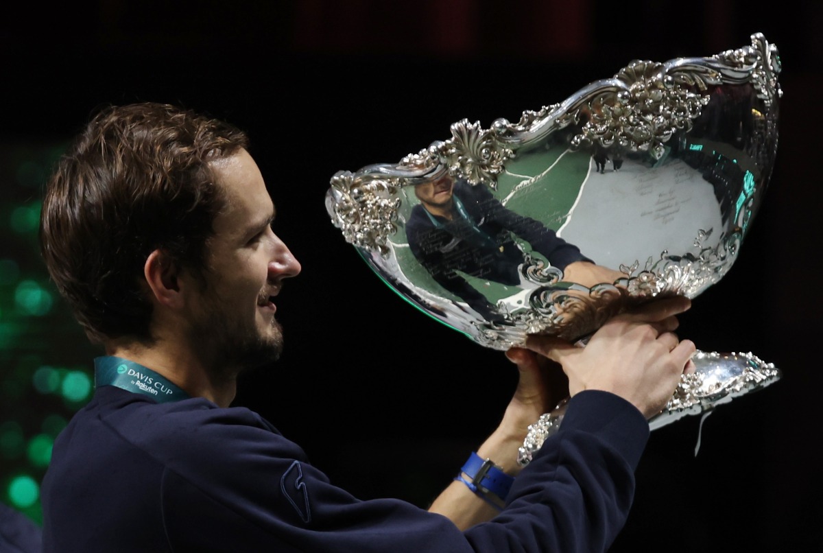 Russian Tennis Federation's Daniil Medvedev celebrates with trophy on the podium winning the Davis Cup REUTERS/Sergio Perez