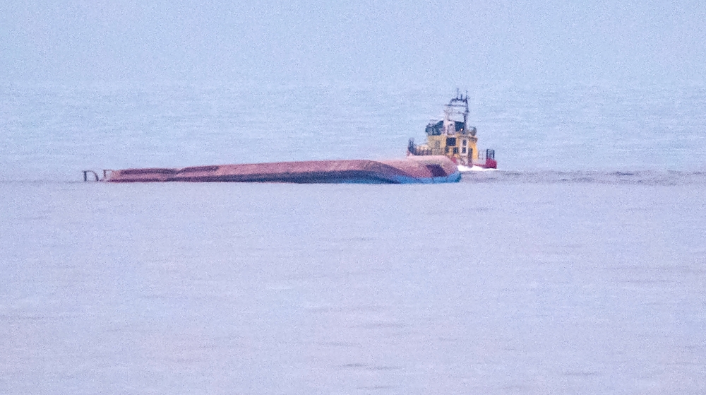 Danish cargo ship Karin Hoej is pictured capsized after colliding with British cargo ship Scot Carrier, between Ystad and Bornholm, on the Baltic Sea December 13, 2021. TT News Agency/Johan Nilsson via REUTERS