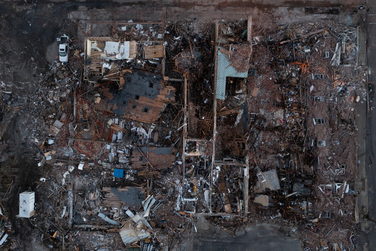 Businesses, including the The Bloom Company, are leveled in the aftermath of a tornado in Mayfield, Kentucky, U.S. December 13, 2021. Picture taken with a drone. REUTERS/Adrees Latif
